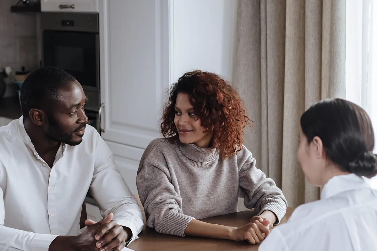 Family interview at a kitchen table