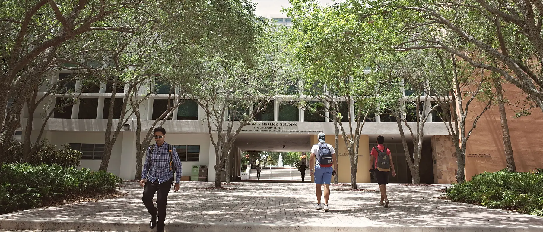 Students walking across a university campus